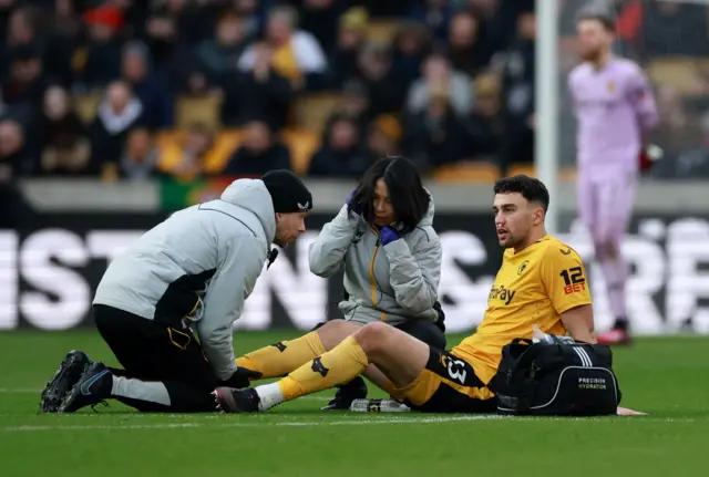 Wolves defender Max Kilman receives treatment