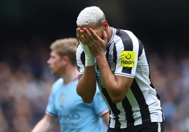 Joelinton reacts to missing a chance against Manchester City