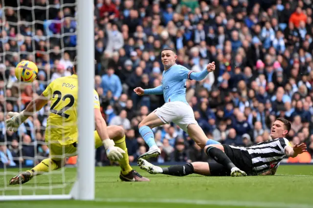 Manchester City midfielder Phil Foden scores against Newcastle