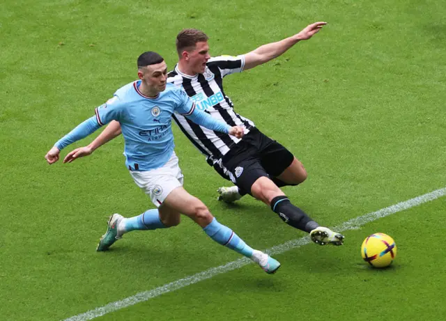 Phil Foden takes a shot against Newcastle