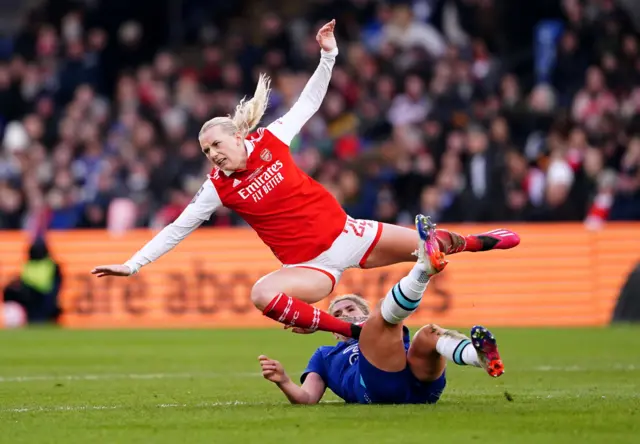 Arsenal's Stina Blackstenius is tackled by Chelsea's Millie Bright