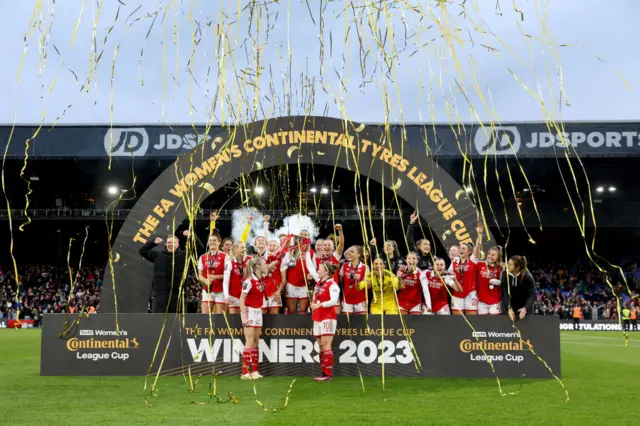 Arsenal lift the League Cup trophy