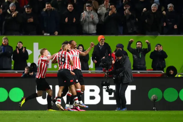 Brentford celebrate Ethan Pinnock's goal.