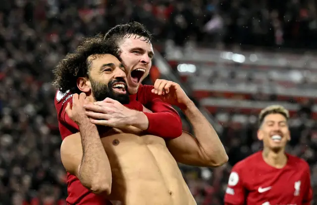 Mohsamed Salah and Andy Robertson celebrate a goal for Liverpool