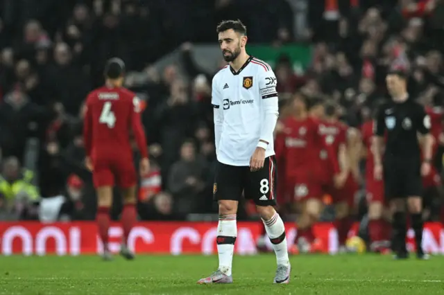 Manchester United's Portuguese midfielder Bruno Fernandes reacts after they concede their sixth goal against Liverpool