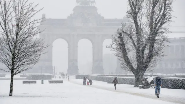 A few centimetres of snow cover the ground near Jubilee Arch, in Brussels, Belgium