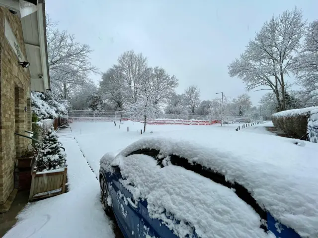 Snow on top of a car