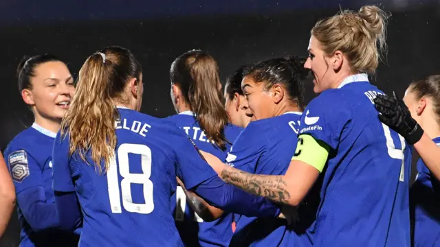 Chelsea's players celebrate scoring against Brighton in the Women's Super League