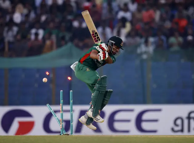 Bangladesh's Najmul Hossain Shanto is bowled out by England's Mark Wood