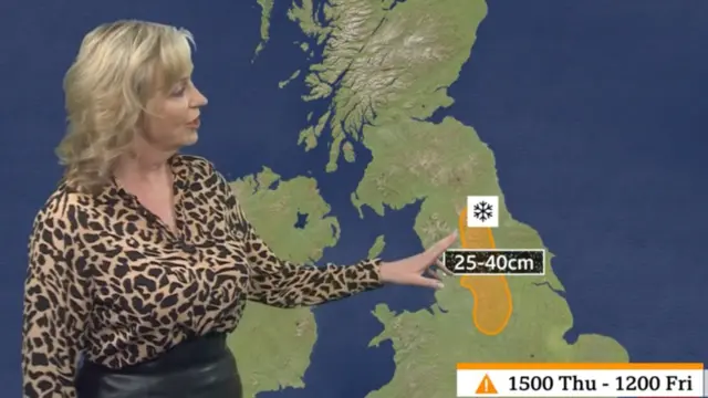 Carol Kirkwood points out the amber weather warning area