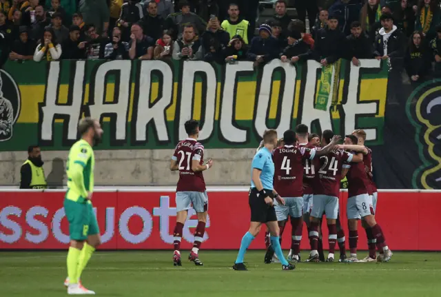 West Ham celebrate their first goal in a huddle