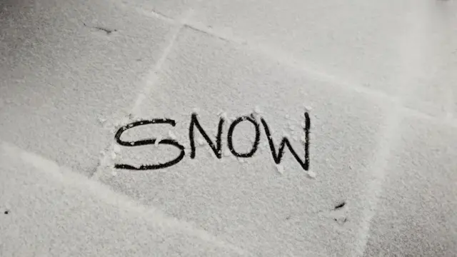 Snow written on a tile