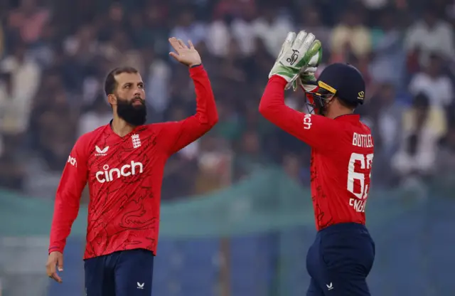 Moeen Ali and Jos Buttler celebrate the wicket of Towhid Hridoy