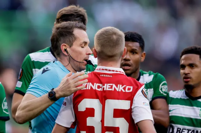 Oleksander Zinchenko is spoken to by the referee