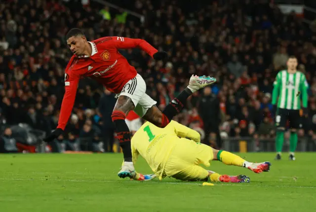 Marcus Rashford is tackled by Claudio Bravo