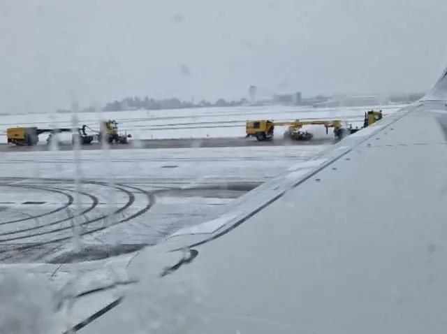 Workers get underway to clear snow and ice at Birmingham airport