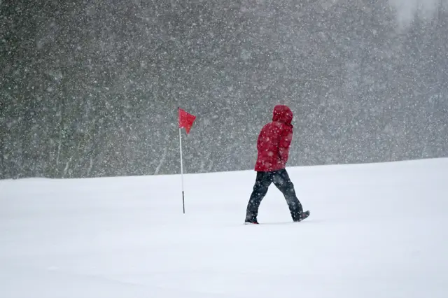 Snow falls at the Saddleworth Moor Golf Course in Uppermill near Oldham