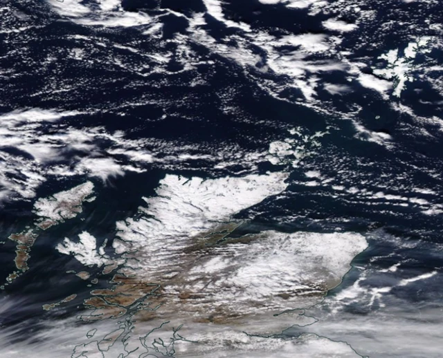 Satellite image showing the north of Scotland covered in snow