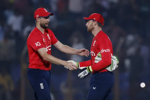 England's Jos Buttler and Chris Woakes after losing the match