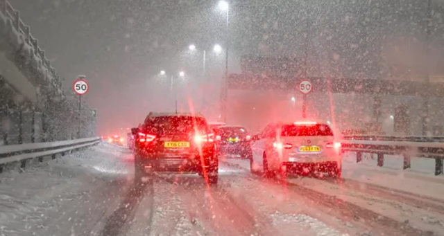 Cars on a road in the snow