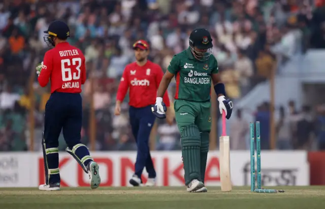 Bangladesh's Rony Talukdar walks after being bowled by Adil Rashid