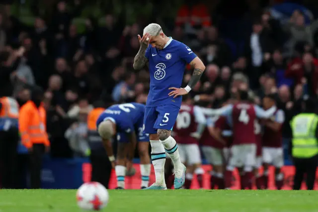 Enzo Fernandez of Chelsea looks dejected after the Aston Villa second goal