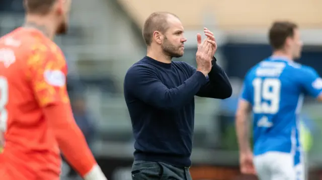 Robbie Neilson applauds the travelling fans