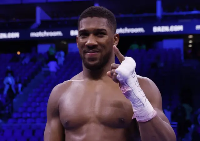 Anthony Joshua smiles