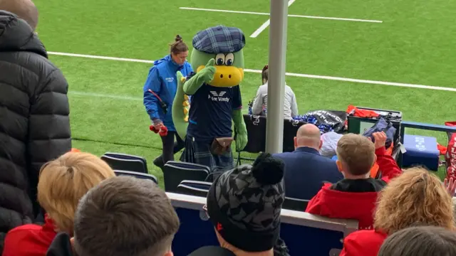 Lochie the Scotland rugby mascot gives a thumbs up