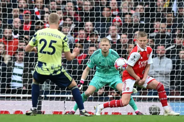 Leeds United's Danish defender Rasmus Kristensen scores their first goal from a deflected shot off Arsenal's Ukrainian defender Oleksandr Zinchenko