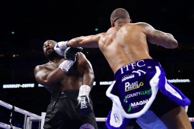 Fabio Wardley aims a punch at his opponent