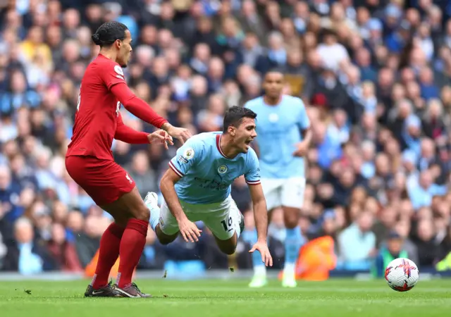 Virgil Van Dijk fouls Rodri.