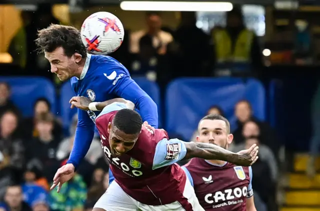 Chelsea's English defender Ben Chilwell fights for the ball with Aston Villa's English defender Ashley Young