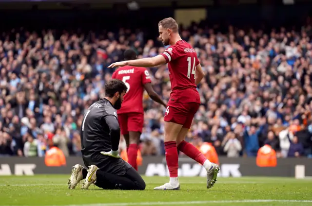 Liverpool keeper Alisson despairs at conceding another goal.