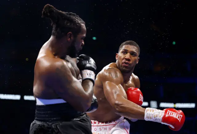 Anthony Joshua throws a punch