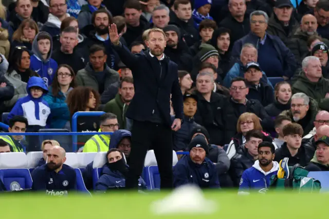 Graham Potter, Manager of Chelsea, directing his players to move down the pitch