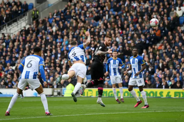 Pontus Jansson of Brentford scores the team's first goal during the Premier League match between Brighton & Hove Albion and Brentford FC