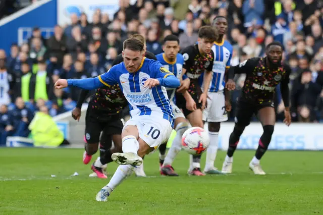 Alexis Mac Allister of Brighton & Hove Albion scores the team's third goal from a penalty kick