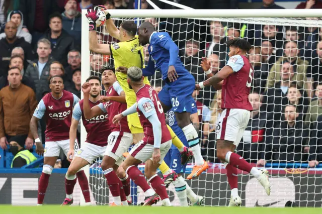 Emiliano Martinez of Aston Villa claims a cross ahead of Kalidou Koulibaly of Chelsea