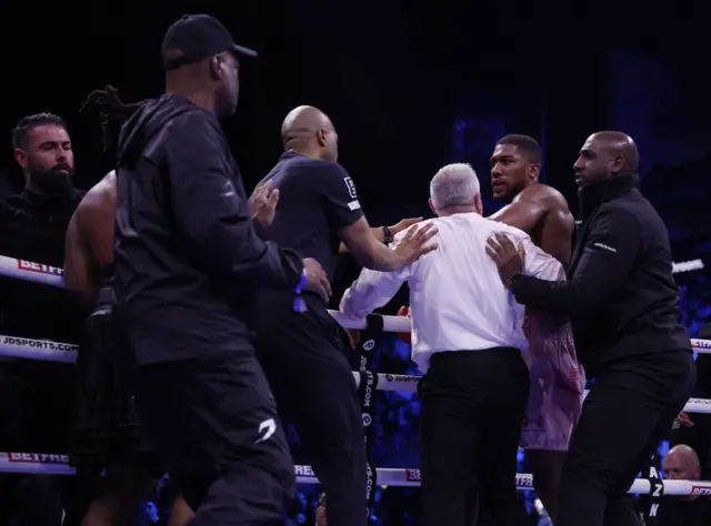 Anthony Joshua and Jermaine Franklin are seperated by security