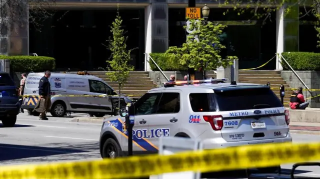 Police deploy at the scene of a mass shooting outside an Old National Bank branch near Slugger Field baseball stadium in downtown Louisville, Kentucky, U.S. April, 10, 2023.