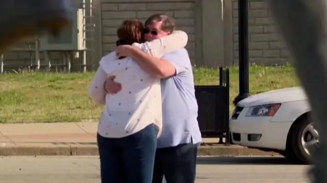 People hugging after Louisville shooting