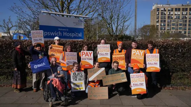 Doctors holding signs outside Ipswich Hospital