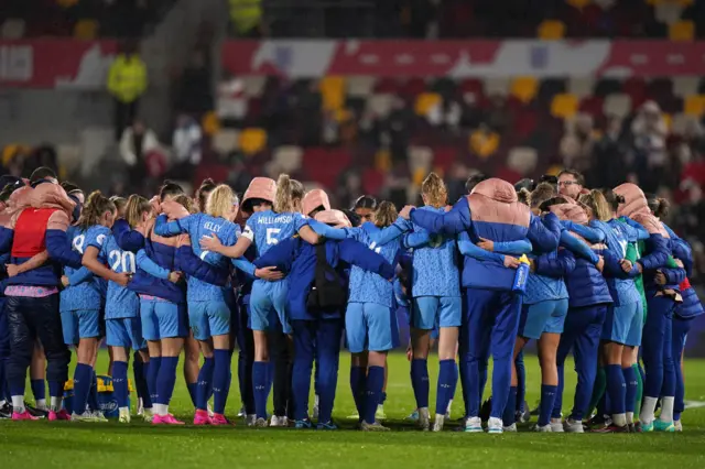 England gather after their defeat to Australia.