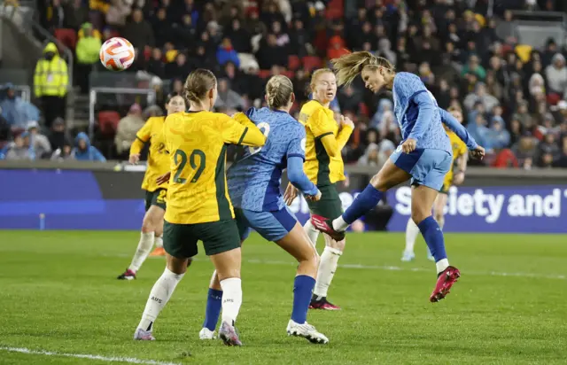 Rachel Daly heads toward goal.