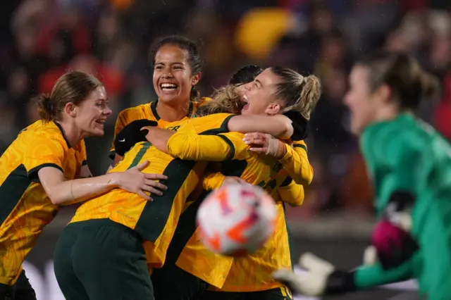 Australia celebrate their win over England.