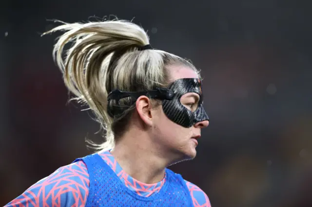 England forwar Lauren Hemp wearing a protective facemask.