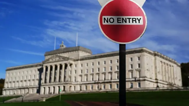 The Northern Ireland Assembly building at Stormont with a "no entry" sign in front of it