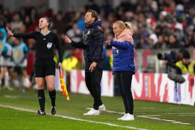 Sarina Wiegman shouts instructions to her players.