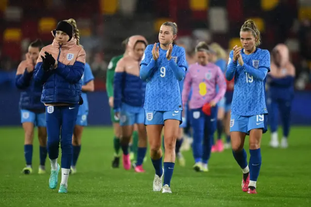 England players applaud their fans after losing to Australia.